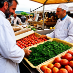 **

A vibrant, colorful food market in Provence, France. Focus on fresh, locally sourced produce: ripe tomatoes, fragrant herbs, crusty bread, and artisanal cheeses. In the background, a chef in a white coat is selecting ingredients, interacting with a friendly farmer. Capture the essence of "terroir" and the connection between the land and the plate. Warm, natural lighting.

**
